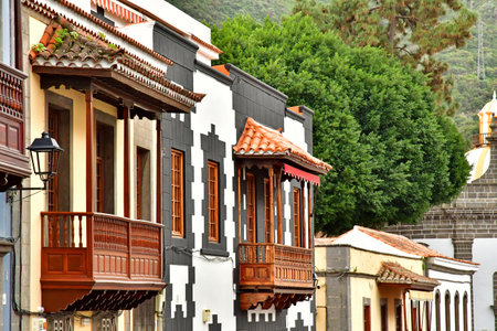 Gran Canaria, Canary Islands - March 15 2024: the picturesque calle Real in the city of Terorのeditorial素材