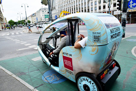 Vienna, Austria - June 24 2023: pedicab in the picturesque city centerのeditorial素材