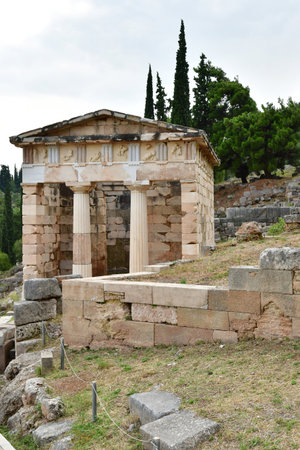 Delphi; Greece - August 31 2022: the Athenian Treasury in the archaeological site