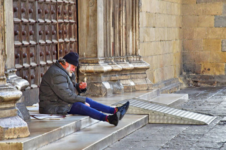 Naples, Italy - March 6 2025: homeless person in the religious complex of Santa Chiaraのeditorial素材