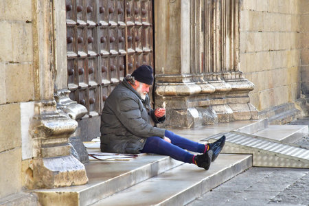 Naples, Italy - March 6 2025: homeless person in the religious complex of Santa Chiara