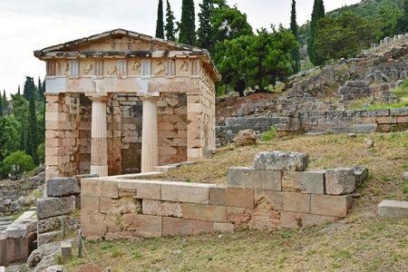Delphi; Greece - August 31 2022: the Athenian Treasury in the archaeological site