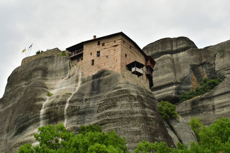 Kalambaka; Greece - August 31 2022: the holy monastery of Saint Nikolaos of Anapafsas in the Meteoraのeditorial素材