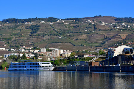 Regua, Portugal - July 10 2022: boat on the Douro riverのeditorial素材