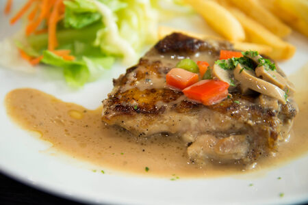 Delicious nourishing steak with vegetables, French fries の写真素材