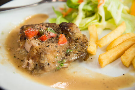 Delicious nourishing steak with vegetables, French fries の写真素材