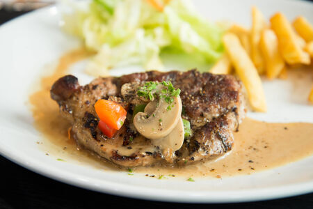 Delicious nourishing steak with vegetables, French fries の写真素材