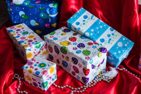 Many gift box on the red carpet.