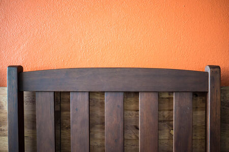 Backrest chair on the orange background in cafe.の写真素材