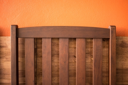 Backrest chair on the orange background in cafe.の写真素材
