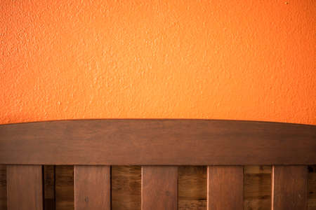Backrest chair on the orange background in cafe.の写真素材