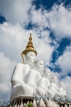 White Buddha statue amidst the mountains in Thailand, wat phasornkaewの写真素材