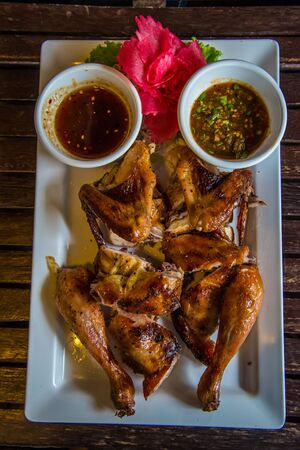 Grilled Chicken on the table in the restaurant.の写真素材