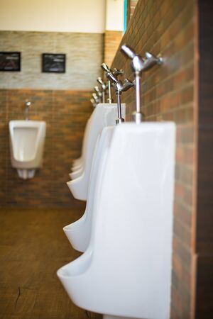 Urinal in the toilet of a restaurant.の写真素材