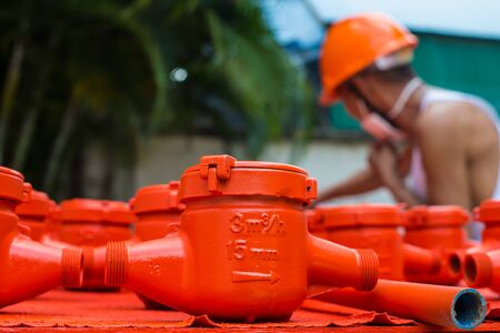 Spraying color many water meter in the factory.の写真素材