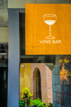 Wooden sign shaped wine glass. Wine Shopの写真素材