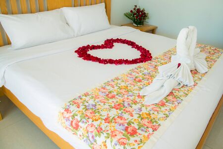 Roses placed on the the bed in wedding day. bridal houseの写真素材