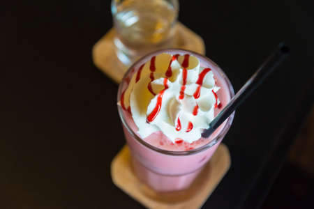 Ice Strawberry Smoothie on the wooden table.の写真素材