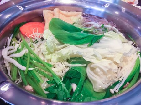 Vegetables are cooked in a hot pot, Sukiyaki.の写真素材