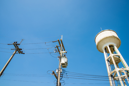 Electricity post and a blue sky background.の写真素材