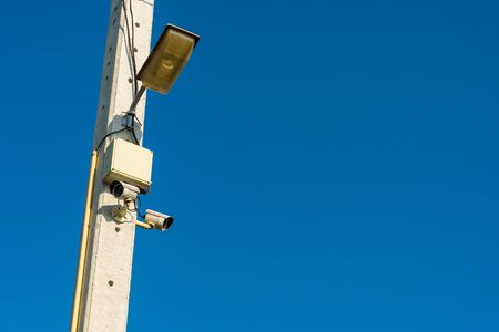 CCTV cameras are installed on electrical poles. safty,の写真素材