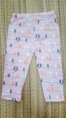 Baby Leggings Pants on white background, clothes for children.の写真素材