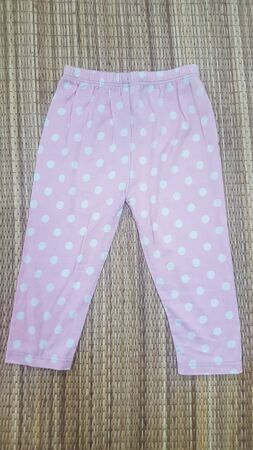 Baby Leggings Pants on white background, clothes for children.の写真素材