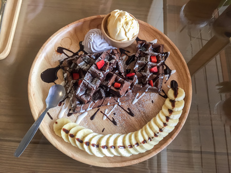 Ice cream dessert on the wooden table in a coffee cafe.の写真素材
