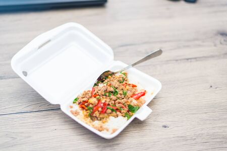 Rice topped with stir-fried pork and basil, dilicious Thai food.の写真素材