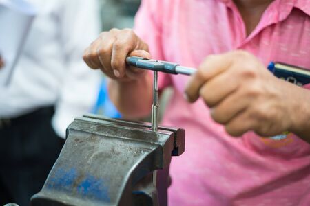 Manual tapping automotive part by carbide tapping tool