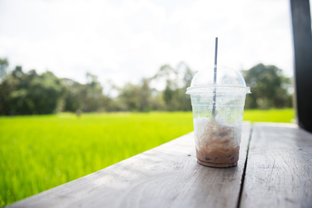 Ice chocolate on a wooden walkway.の写真素材