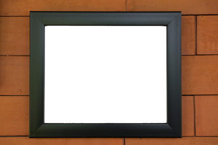 Black frame on the brick wall background. White poster or a white picture frame