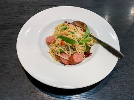 Delicious spaghetti Sausage in restaurant of Thailandの写真素材