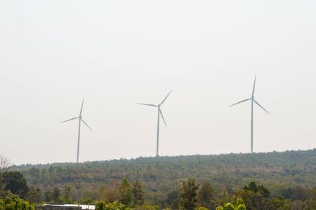 Windmills for electric power production on mountainの写真素材