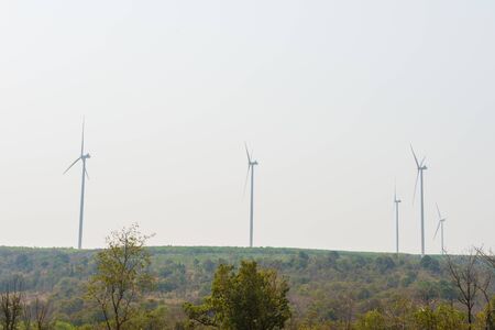 Windmills for electric power production on mountainの写真素材