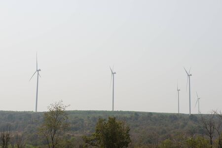 Windmills for electric power production on mountainの写真素材