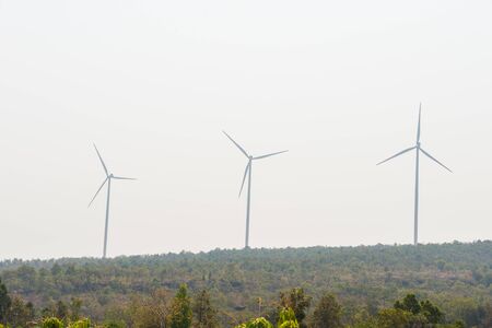 Windmills for electric power production on mountainの写真素材