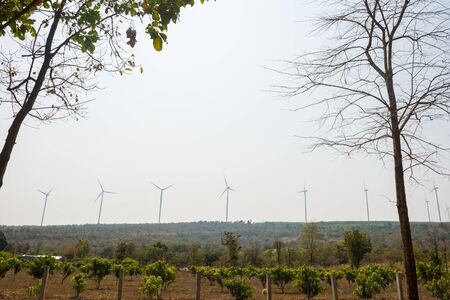 Windmills for electric power production on mountainの写真素材