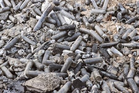 Glass and plastic waste deposited in roadside ditch after traffic accidentの写真素材