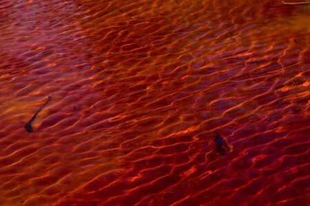 Reddish water from an abandoned copper mine, natural lightの写真素材