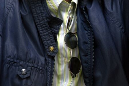 Sunglasses hanging in a sheathの写真素材