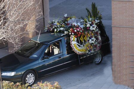 Hearse with wreaths of flowersの写真素材