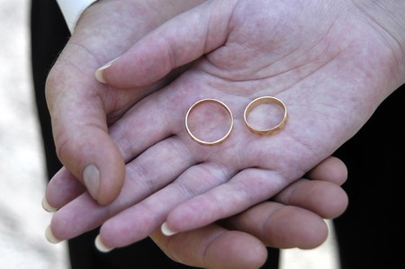 Hands with wedding alliancesの写真素材