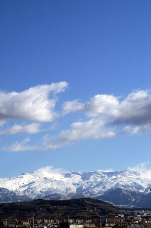 Clouds over the high mountains of Sierra Nevadaの写真素材