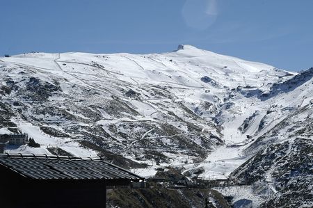View Pradollano urbanization in Sierra Nevada, Veleta Peak in the backgroundの写真素材