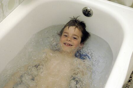 Child in bathtub の写真素材