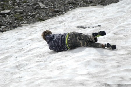Children playing in the snowの写真素材