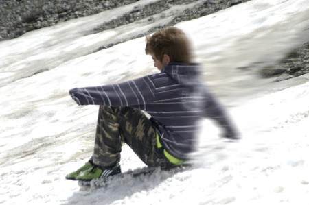 Children playing in the snowの写真素材