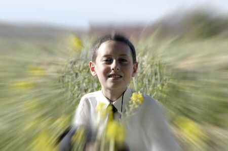 Child Costume Dress First Communion in the fieldの写真素材