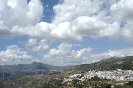 lanjaron overview of the sierra nevada in the background with low clouds in the alpujarra in granadaのeditorial素材